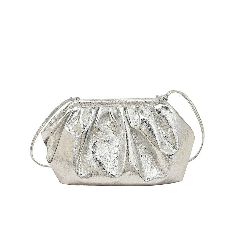 Shell-shaped crossbody bag with hair clip shoulder strap showing multiple compartments including mobile phone pocket