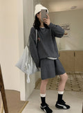 Women's milk blue casual knitted sports suit with animal embroidery on top and matching shorts.