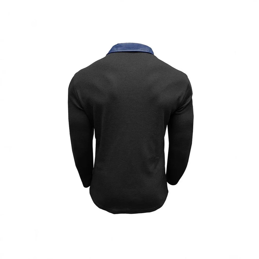Man modelling a loose-fit long sleeve polo shirt with a waffle-texture fabric in a solid colour.