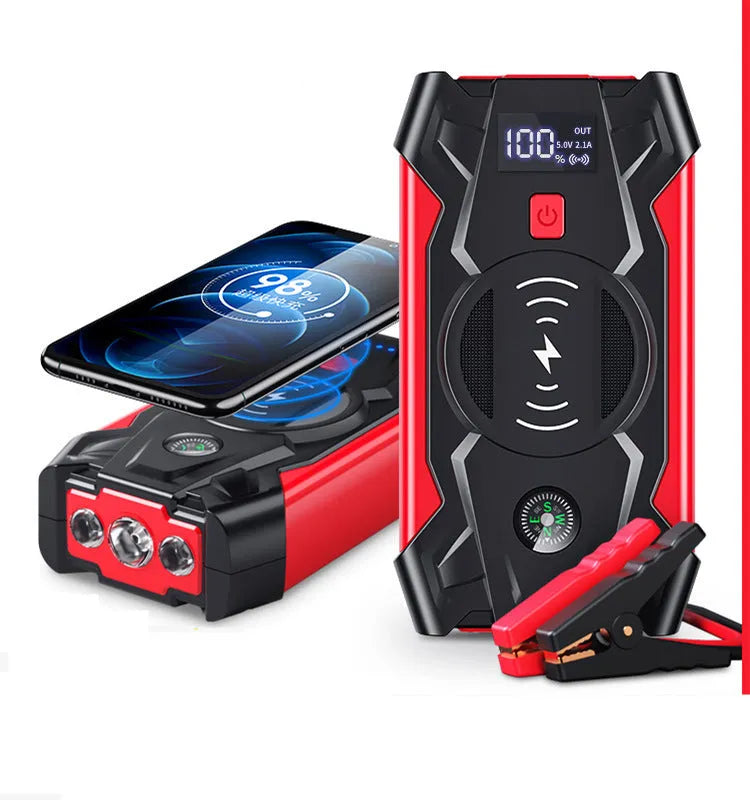 Red portable car jump starter with thick clips and digital display for emergency vehicle battery boosting