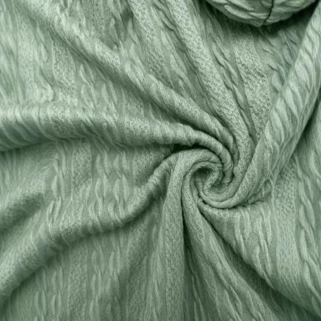 Green women's hooded zipper sweater jacket laid flat, showing casual loose fit and long sleeves.