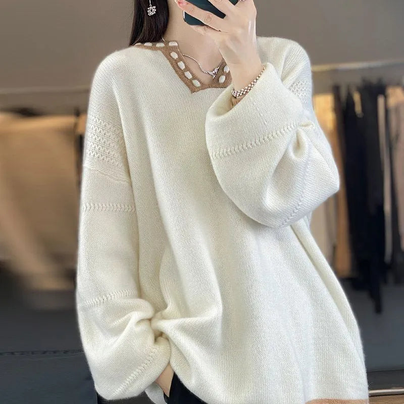 Women's camel coloured V-neck viscose pullover sweater with long sleeves on a hanger.