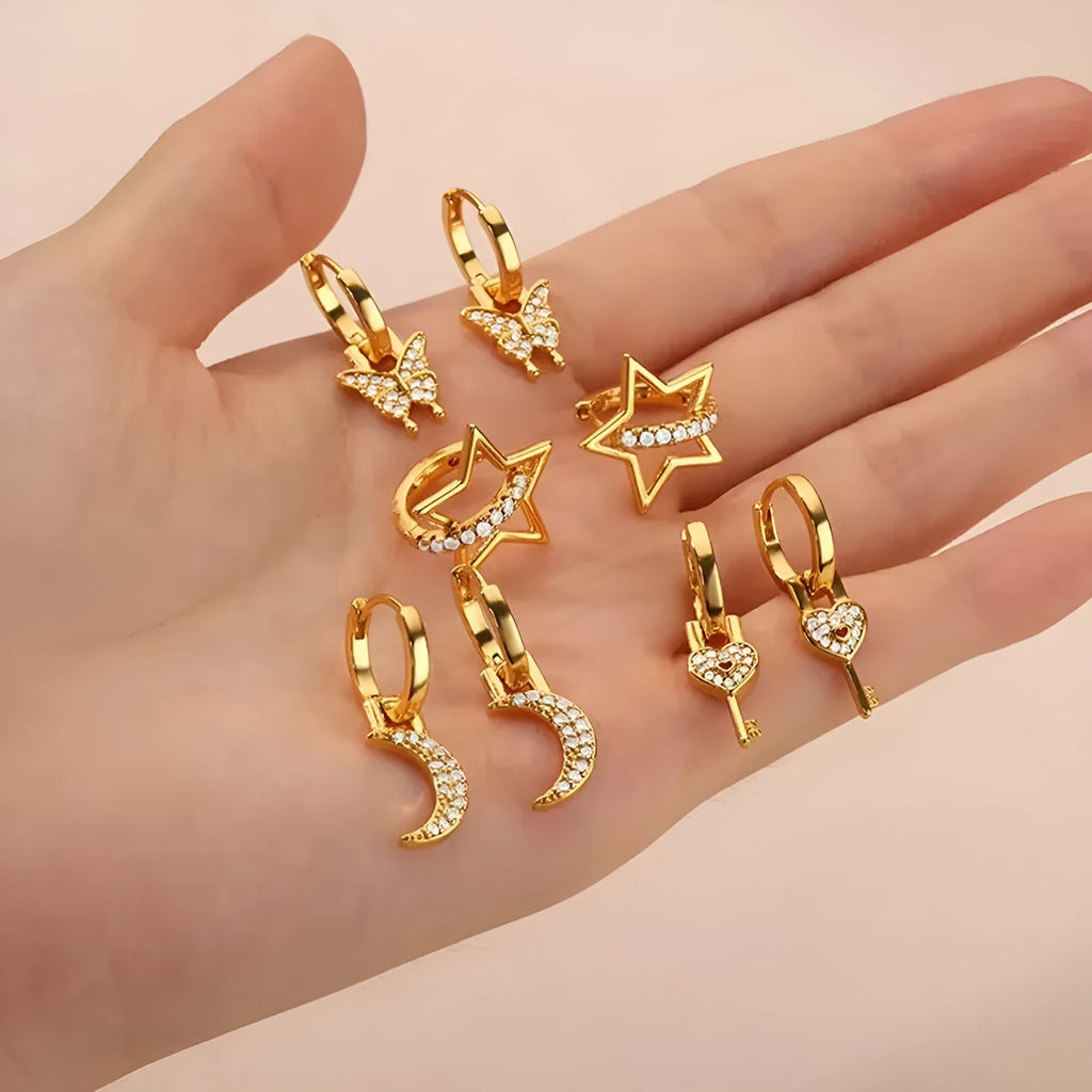 Close-up of women's geometric butterfly drop earrings with heart, star, and bow shapes in copper.