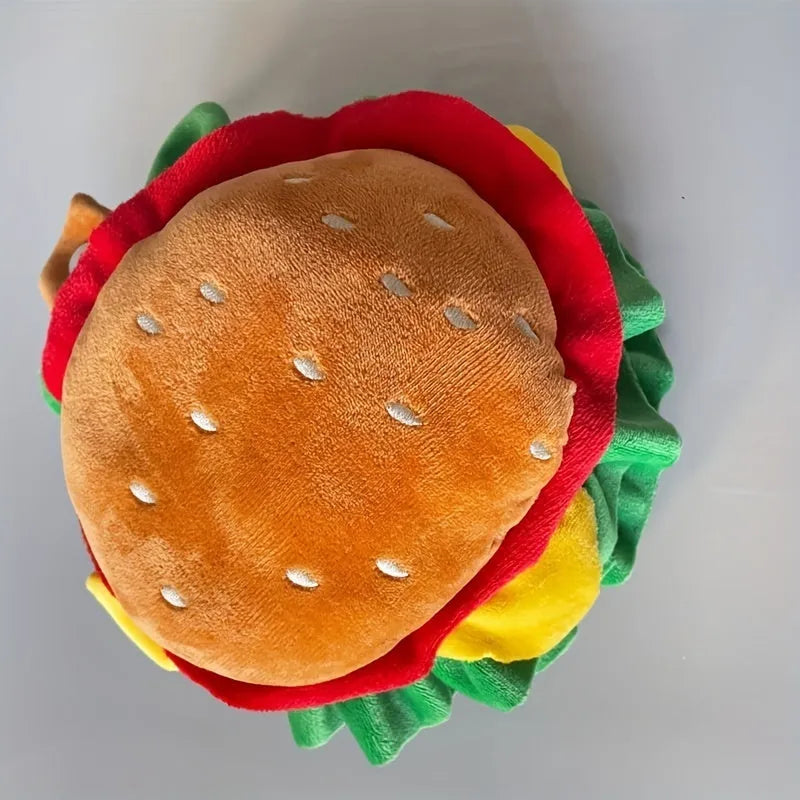A cat wearing a soft cone collar with a colourful cartoon burger hat on top, sizes S M L available.