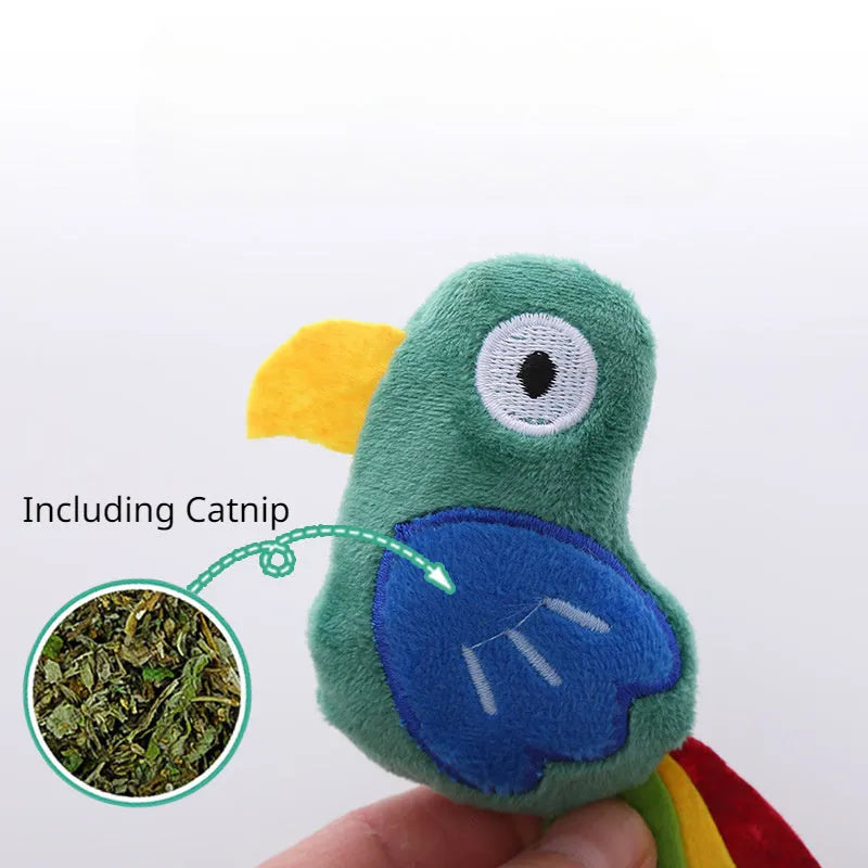 Soft plush cat toy shaped like a cow or parrot, filled with catnip, on a neutral background.
