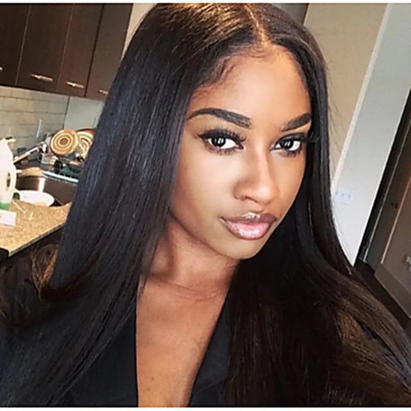 Long straight black synthetic wig with centre-parted bangs on a mannequin head