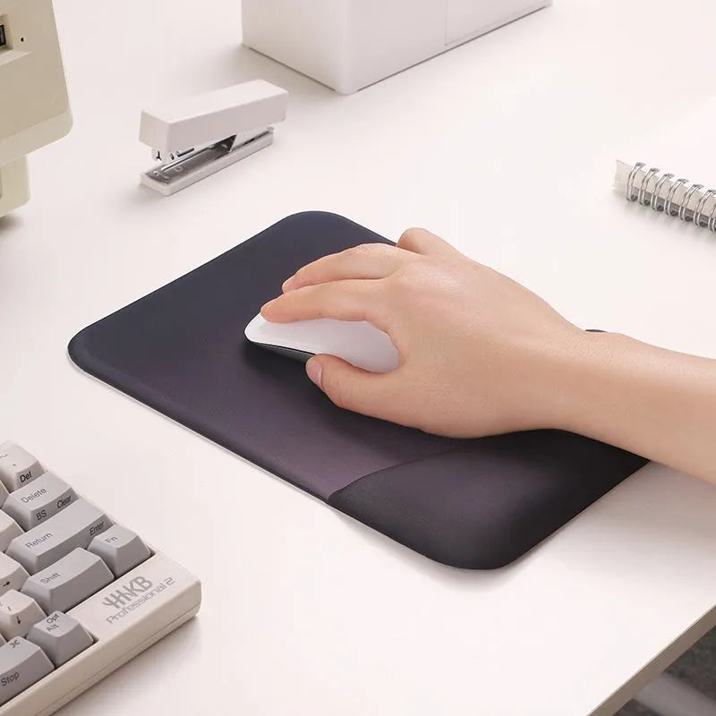 Square silica gel wrist rest mouse pad with strap on a desk, 250mm by 180mm, cloth surface