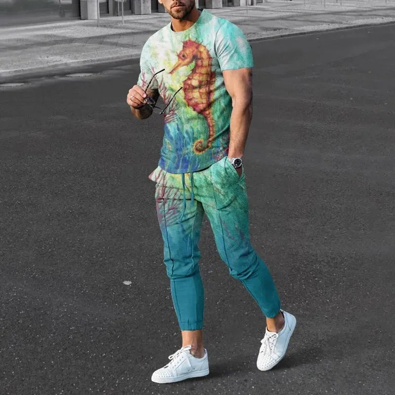 Man wearing a printed short-sleeve t-shirt and matching trousers from a cotton-like men's tracksuit set.