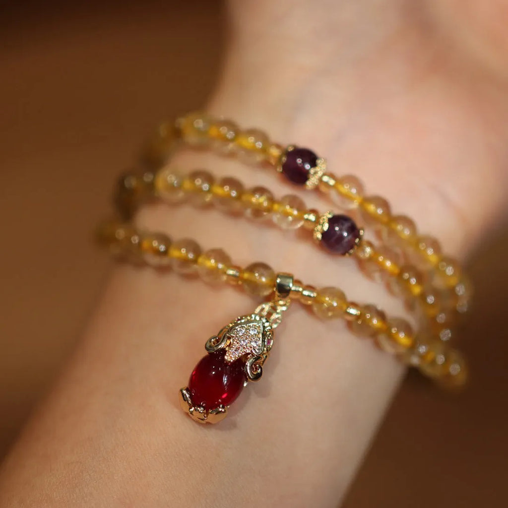 Brazilian Rutilated Quartz bracelet with gold beads and hanging chopsticks pendant