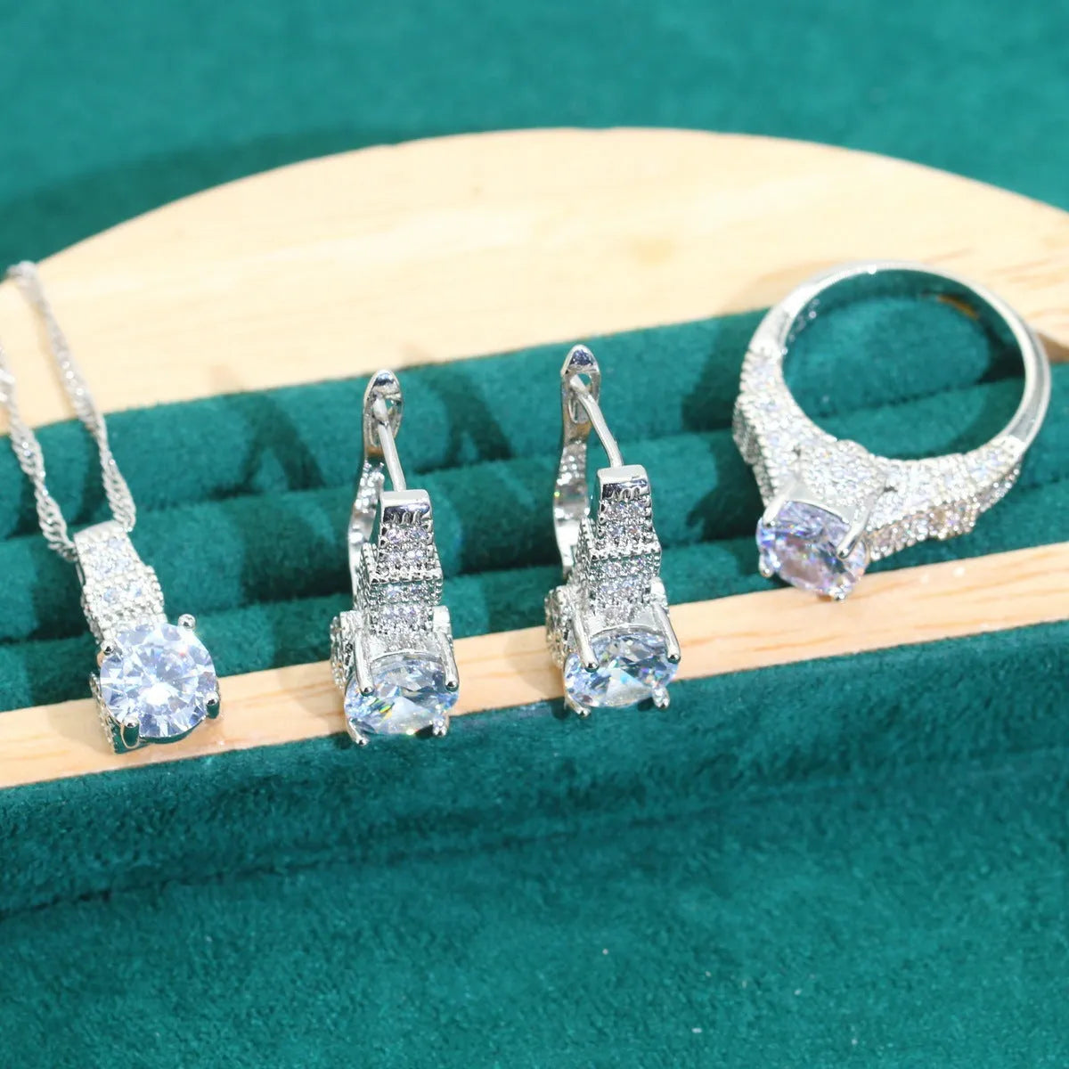 Four-piece bridal jewellery set with necklace, bracelet, earrings, and ring in alloy with zircon detail