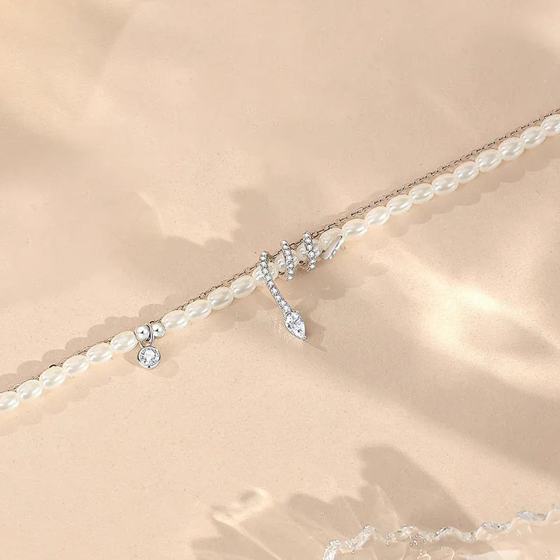 Pearl snake bracelet in 925 silver with electroplated gold or white gold colour on a wrist.