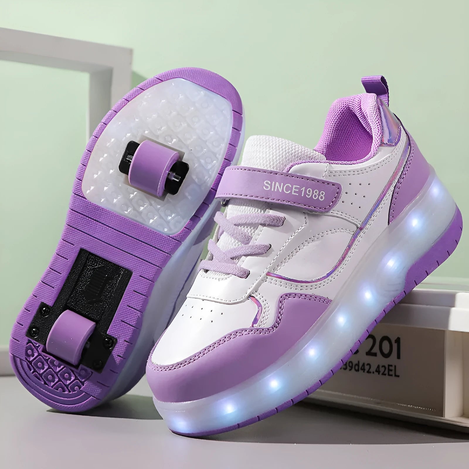 Child wearing charging flash roller skates with illuminated LED wheels, showing pink and black colour options.