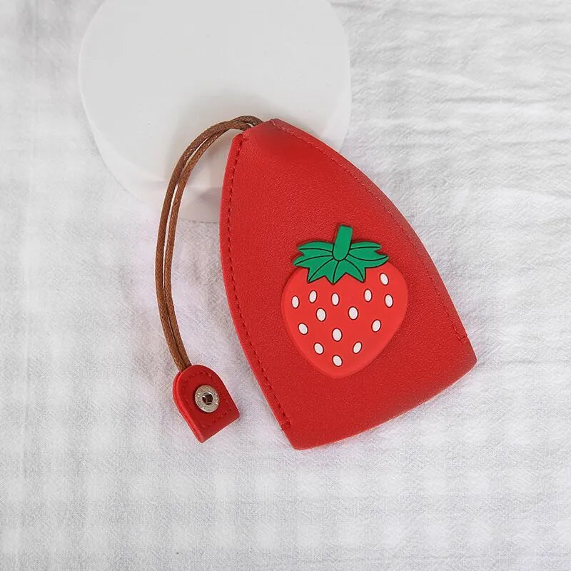 Cartoon pull-out key case in PU leather with colourful design, showing compact 14cm by 7.5cm dimensions