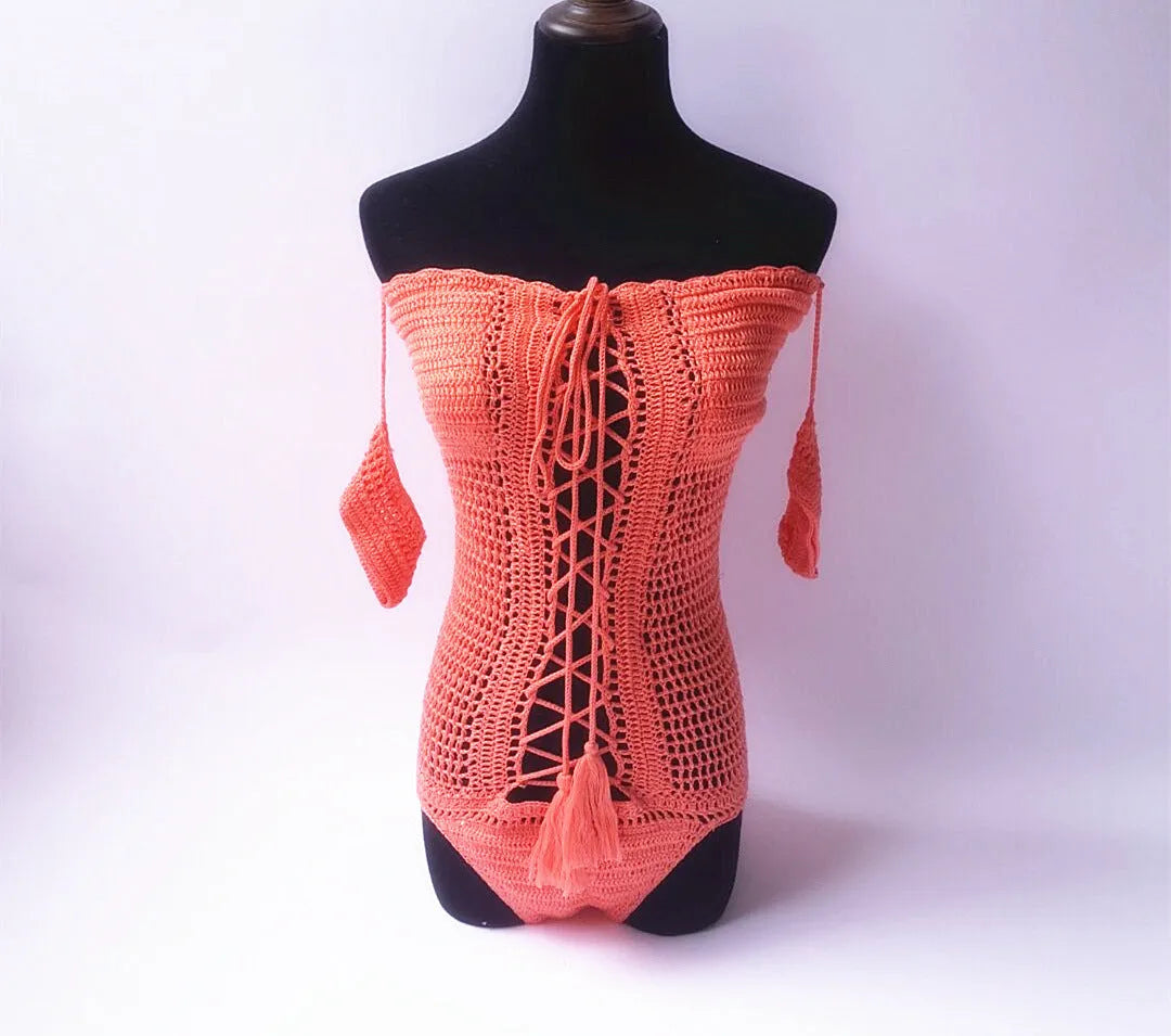 Off-shoulder one-piece swimsuit on a mannequin in light pink colour.