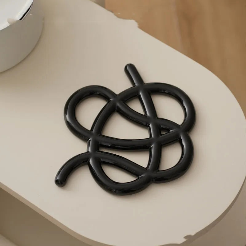 Ceramic heat proof mat in modern minimalist design with irregular shape