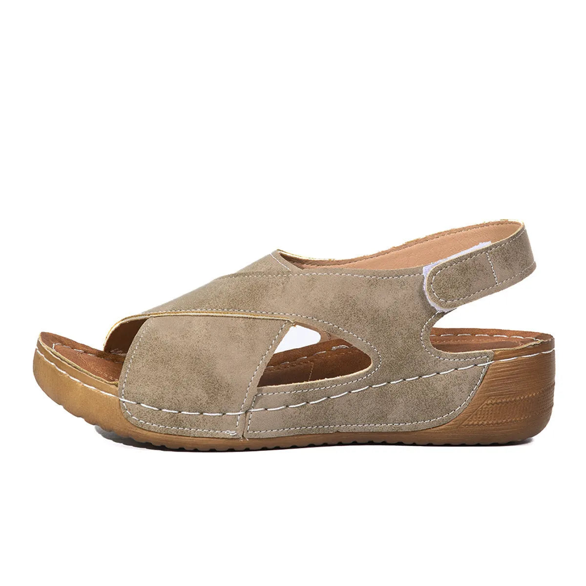 Women's brown platform Roman sandals with Velcro strap and open toe on a rubber sole.
