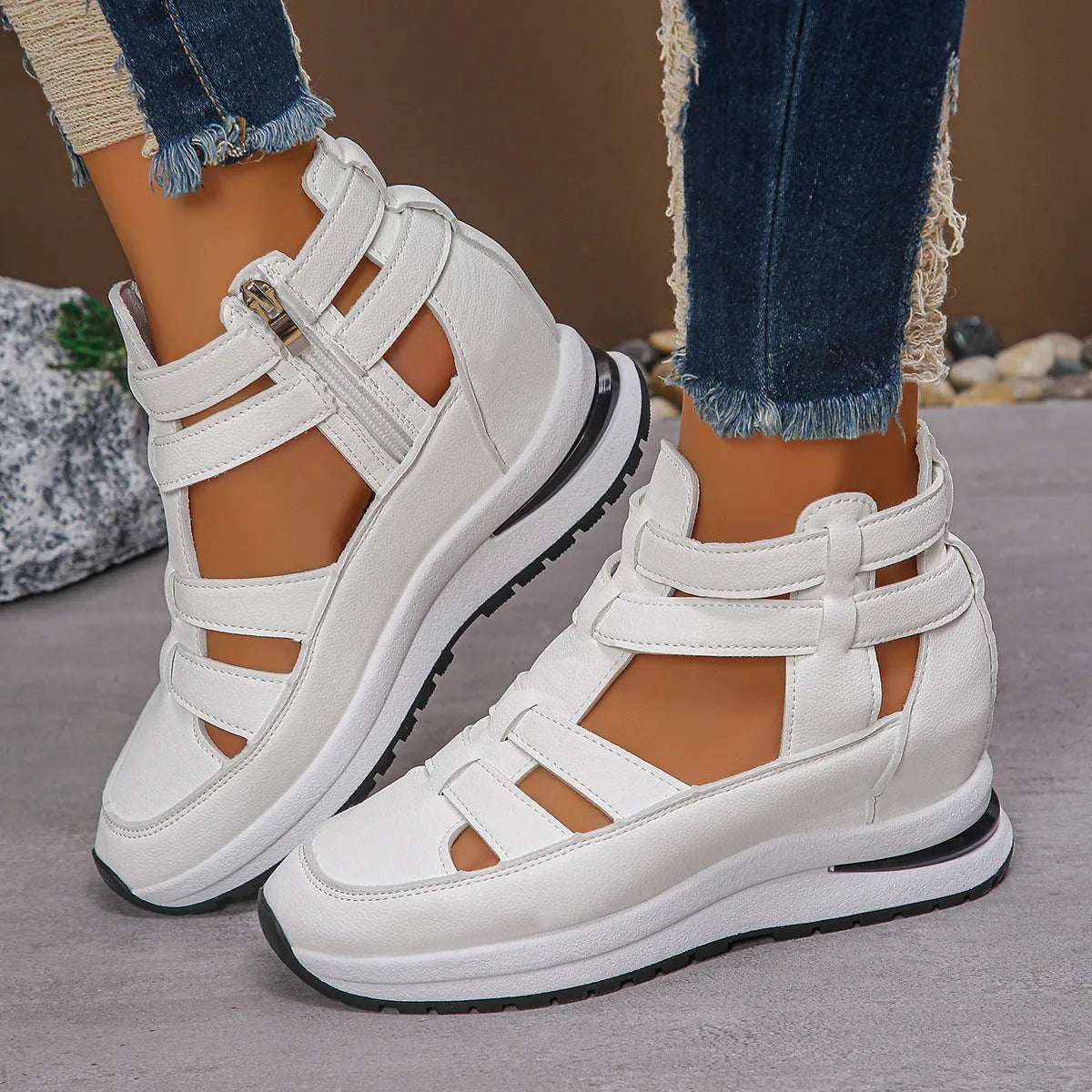 Women's black close-toed hollow-out platform sandals with a Velcro strap on a white background.
