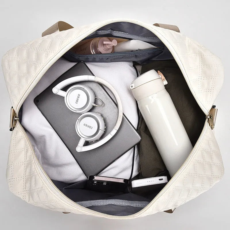 Oxford cloth travel bag with 36-55 litre capacity for leisure trips and buggy use in solid colour options