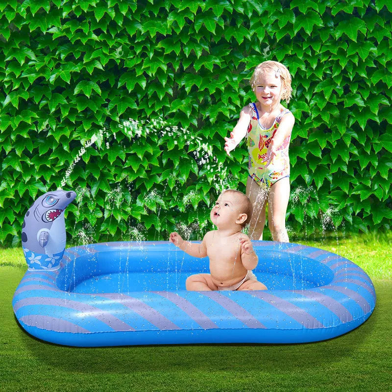 Blue and yellow dinosaur and shark themed large inflatable water spray pool for kids in a garden