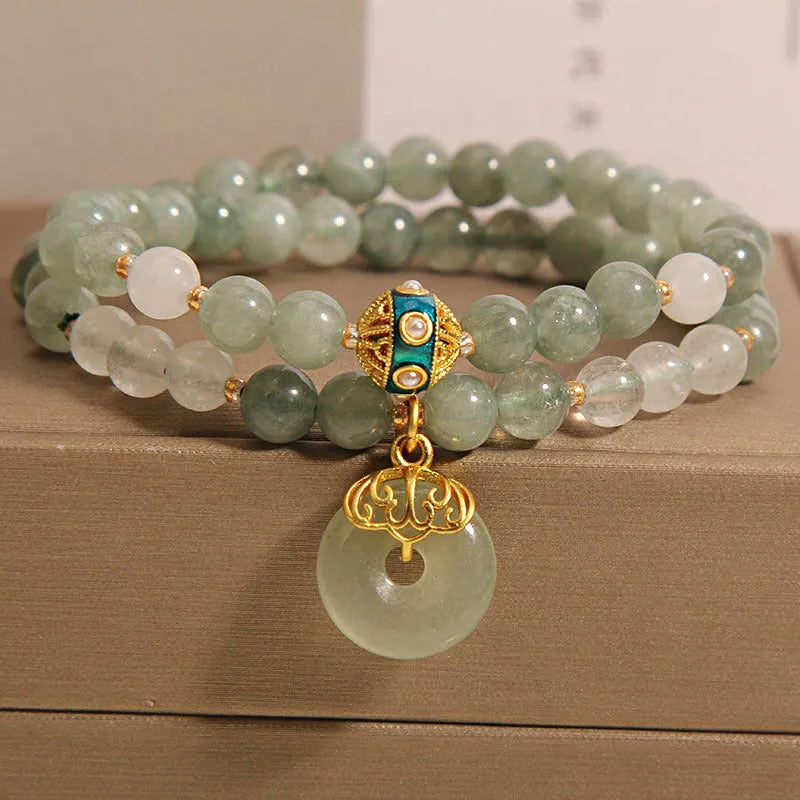 Women's double-layer crystal bracelet with peace buckle in oil emerald colour and rhinestone detailing