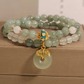 Women's double-layer crystal bracelet with peace buckle in oil emerald colour and rhinestone detailing
