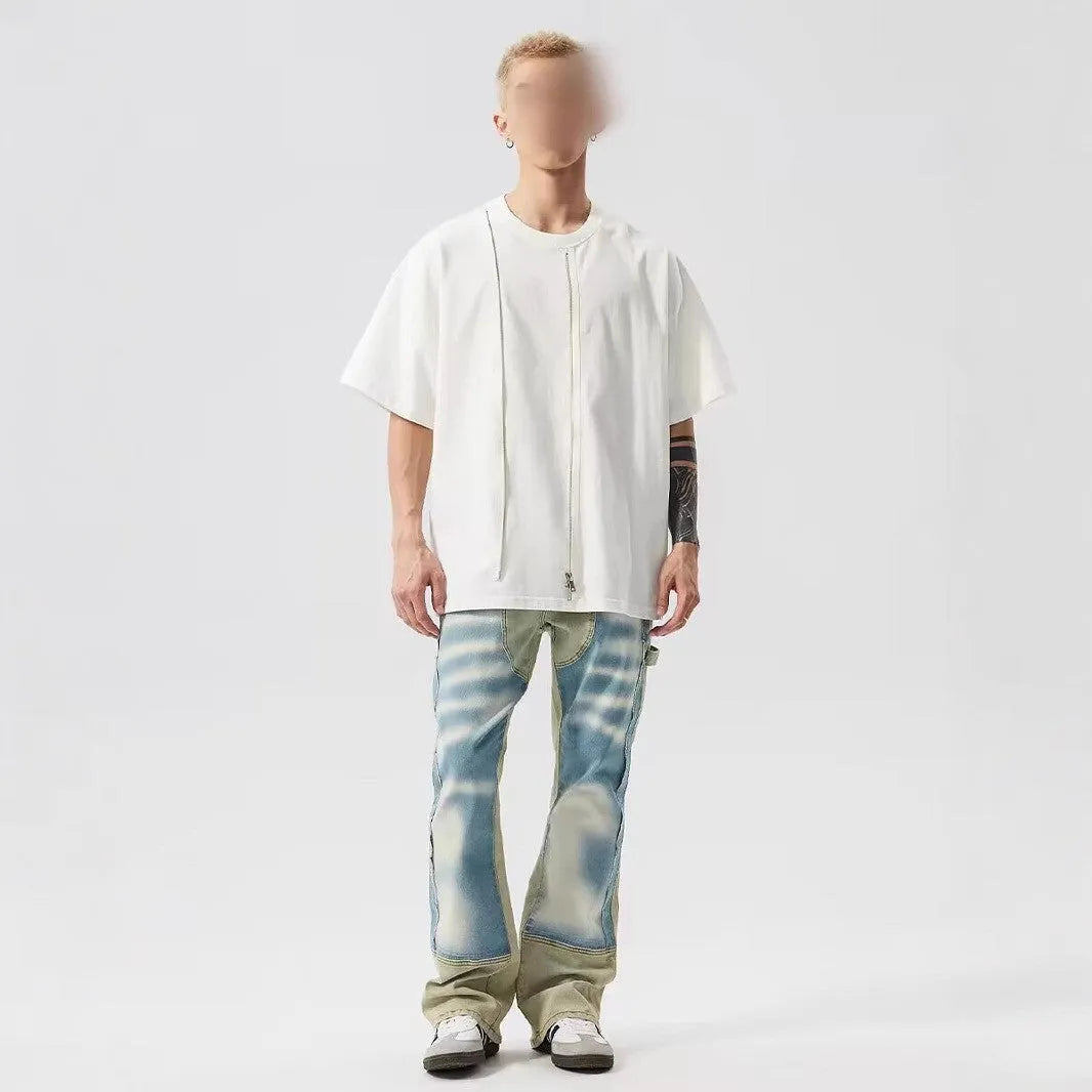 Retro yellow and blue patchwork jeans with splash-ink damaged design showing front and back views