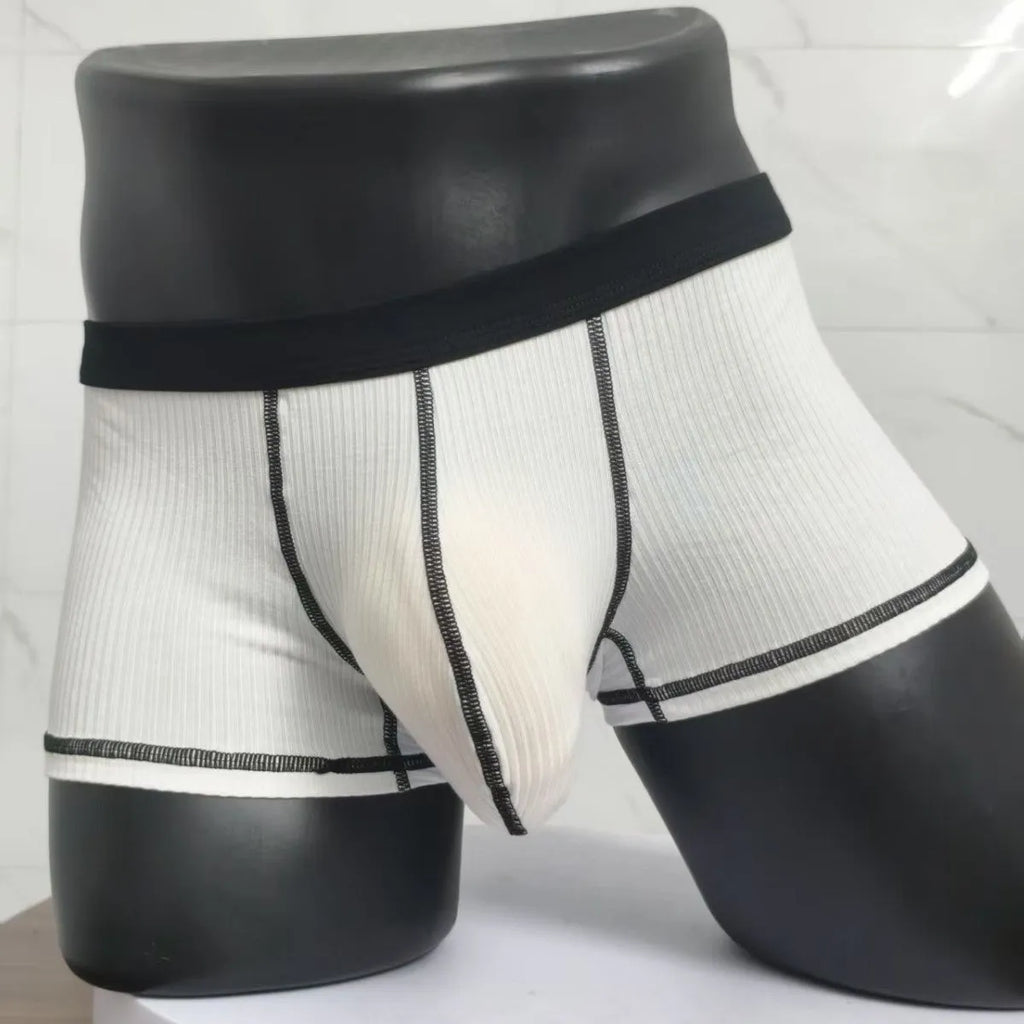 Men's solid colour boxers in breathable fibre fabric showing hip-lifting design