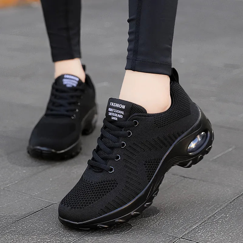 Women's red mesh sneakers with front lace-up design, round toe, and flat mid heel