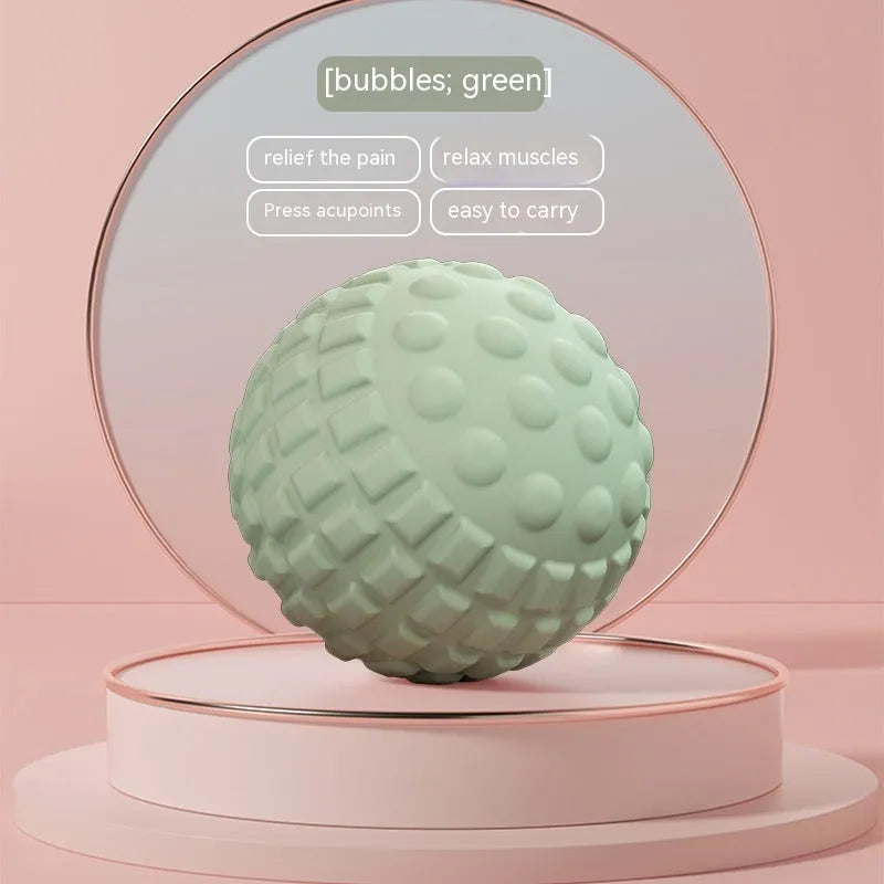 Blue TPR foot massage ball with spiky texture on wooden surface