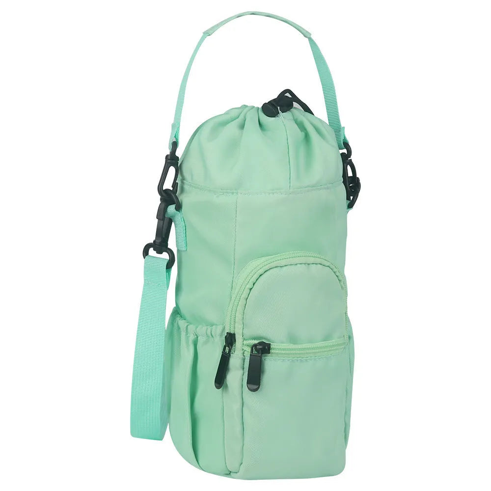Canvas crossbody water bottle pouch in black green and pink holding a cup