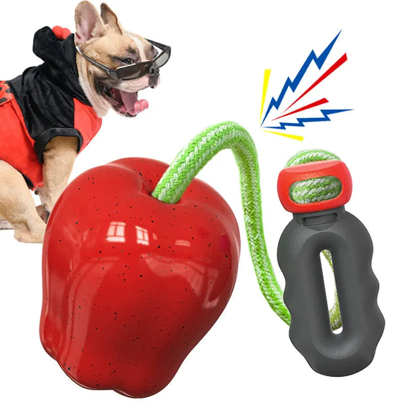 Green Apple-shaped plastic dog toy with dropping ball design containing squeaker