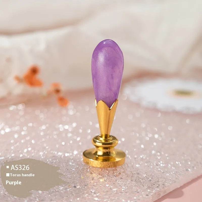 Wooden wax seal handle in a selection of different colour and decorative finishes.