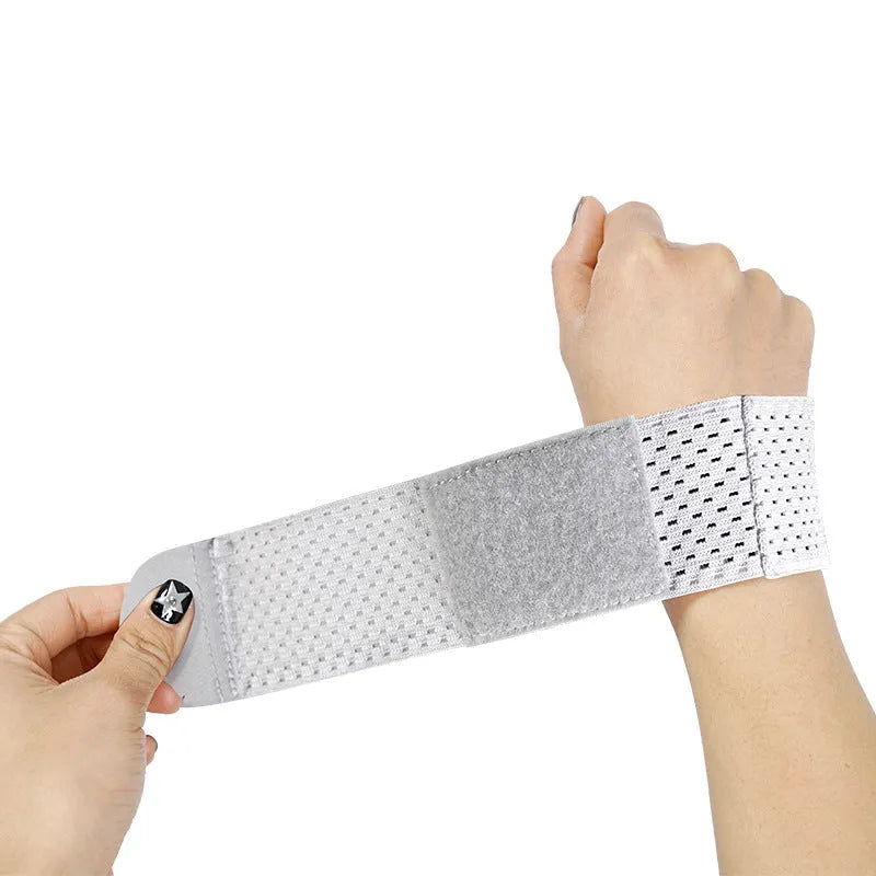 Athletic wristguard in pink black or gray showing high elastic breathable fabric for wrist support