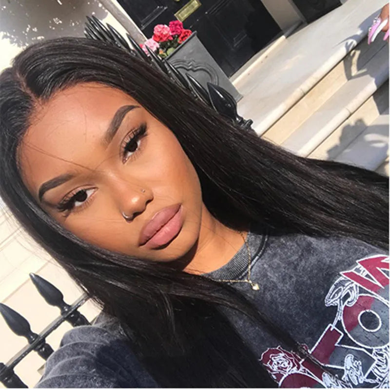 Long straight black synthetic wig with centre-parted bangs on a mannequin head