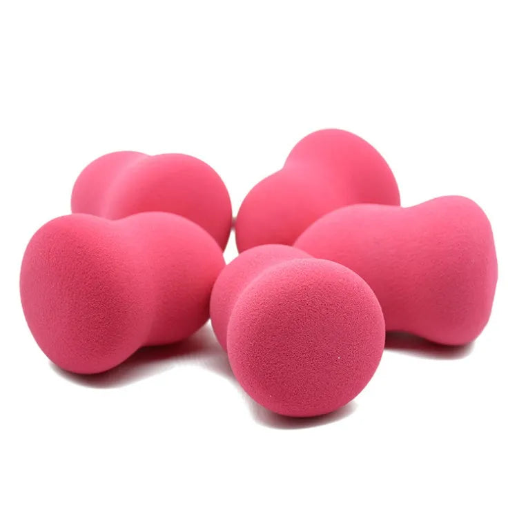 Pink hydrophilic non-latex makeup sponge measuring 4 by 4 by 5.6 centimetres.