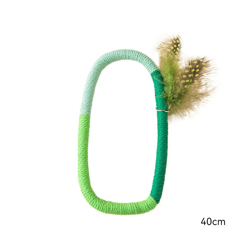 Green circular cotton rope cat toy with white feathers attached for interactive feline play