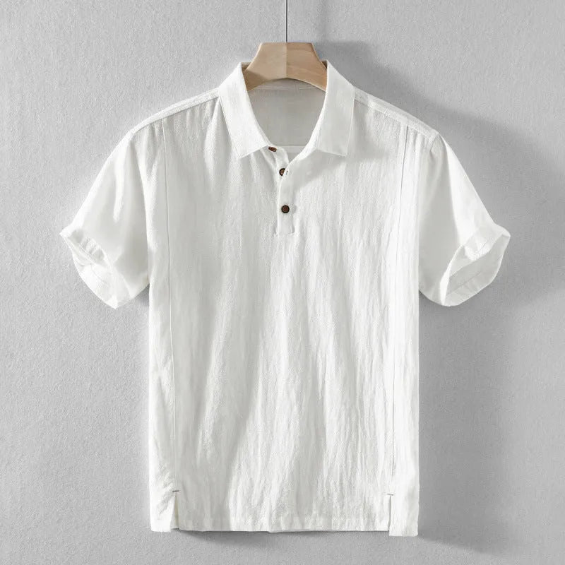 Man wearing a loose fit, light grey linen casual shirt.
