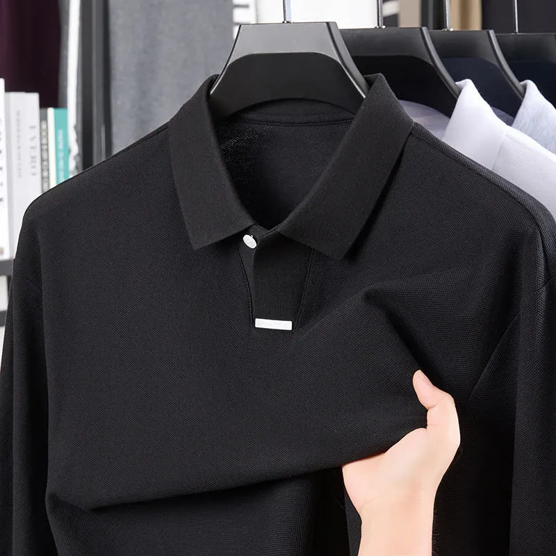 Men's grey cotton polo shirt with lapel collar and long sleeves showing loose fit design