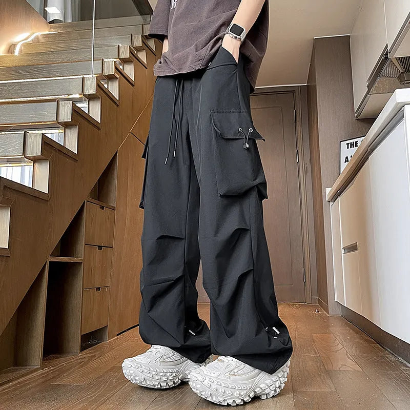 Plus size black straight-leg waterproof trousers with an elastic drawstring waist