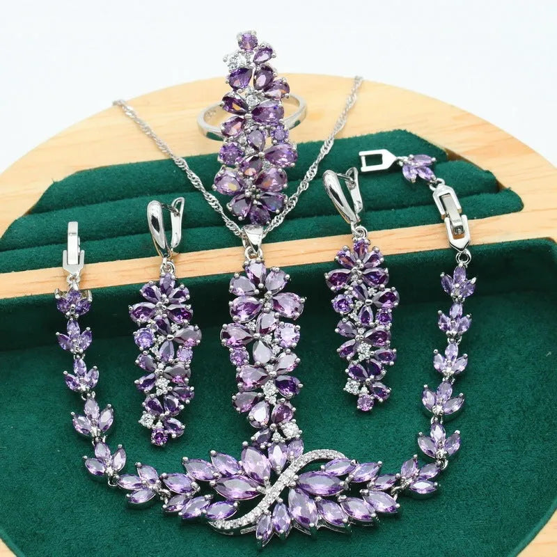 Complete retro floral jewellery set in copper with zircon stones, showing necklace, bracelet, earrings, and ring in olive green finish.