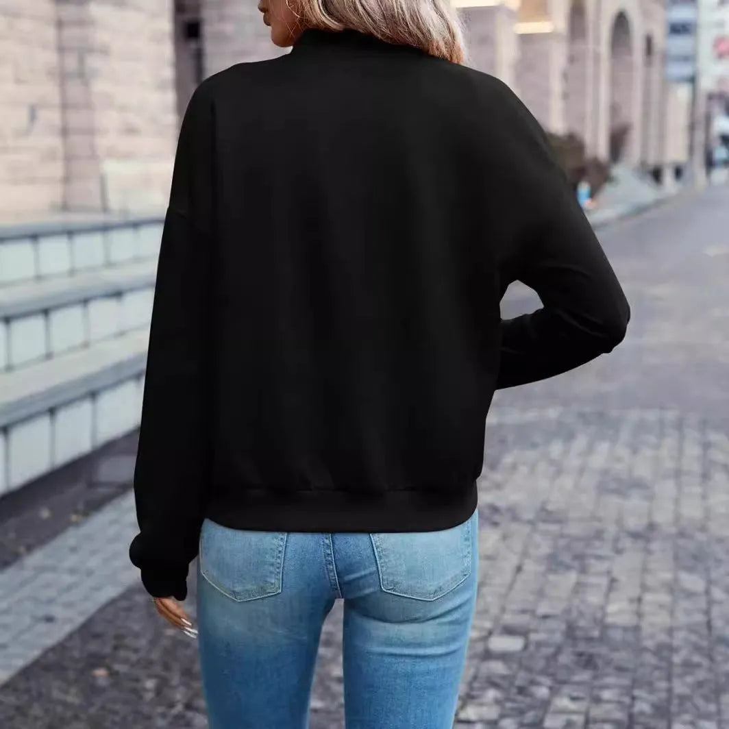 Black women's casual zip-front jacket with long sleeves and faux pockets.