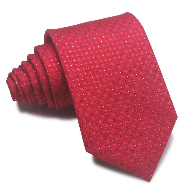 Close-up of a red, black, and blue striped men's formal tie with a textured Jacquard weave.