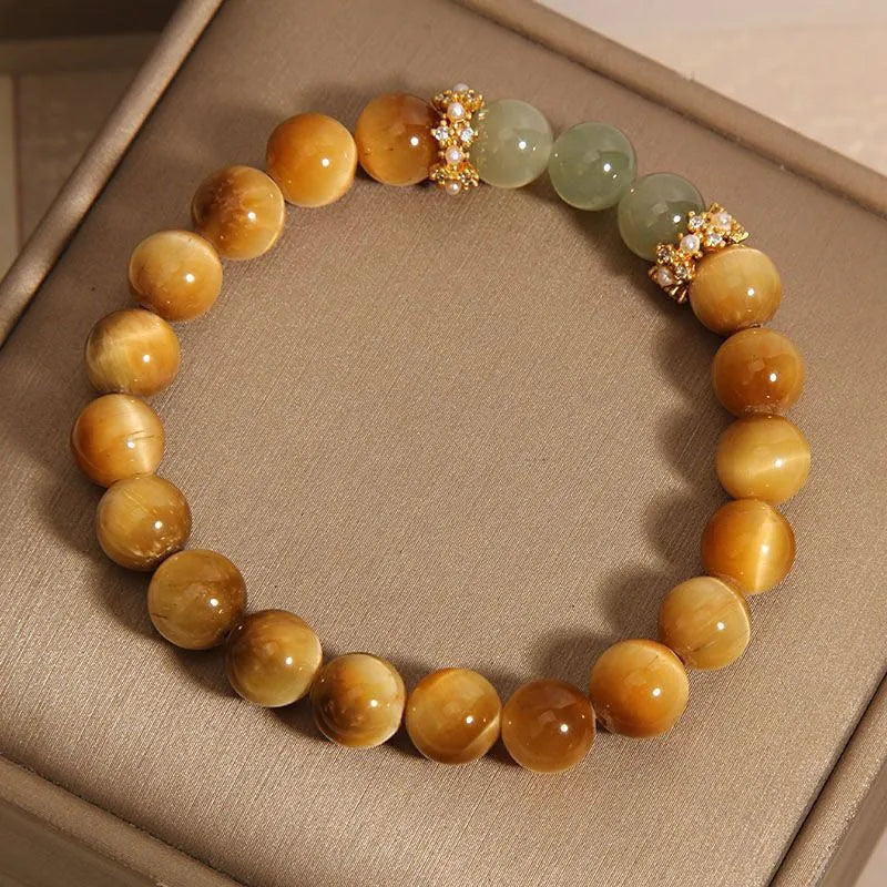 Natural yellow tiger's eye and Hetian jade bracelet with U-shaped bead design showing golden gourd pattern