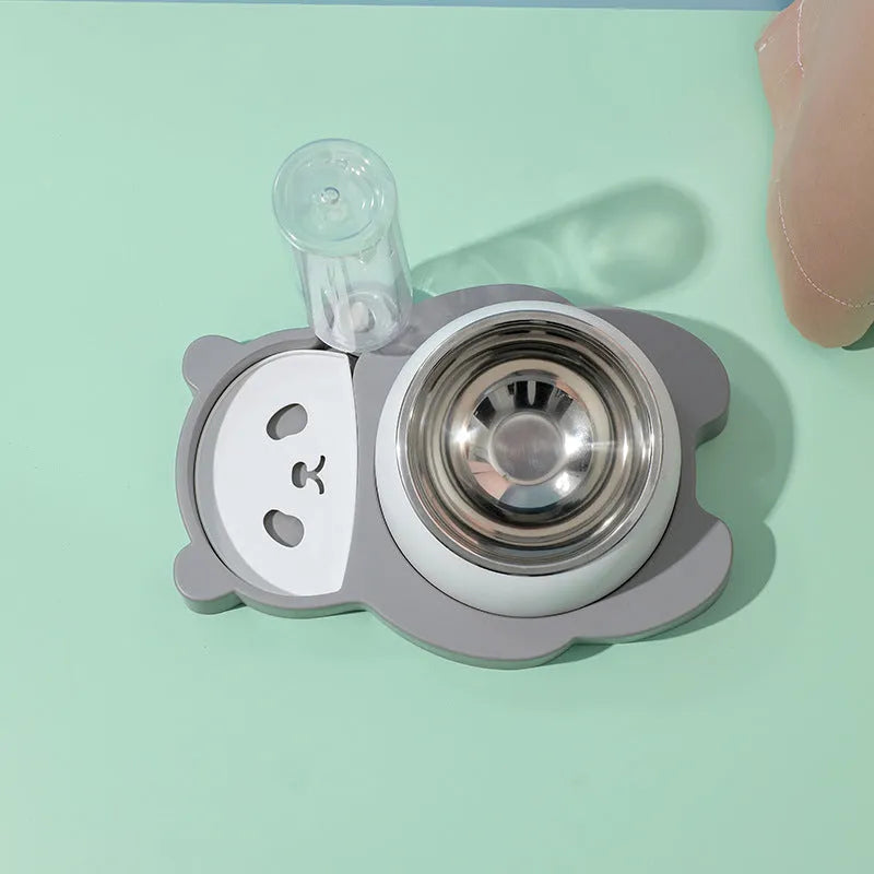 Grey and green panda-shaped automatic pet feeder with tilted stainless steel bowls and water bottle.