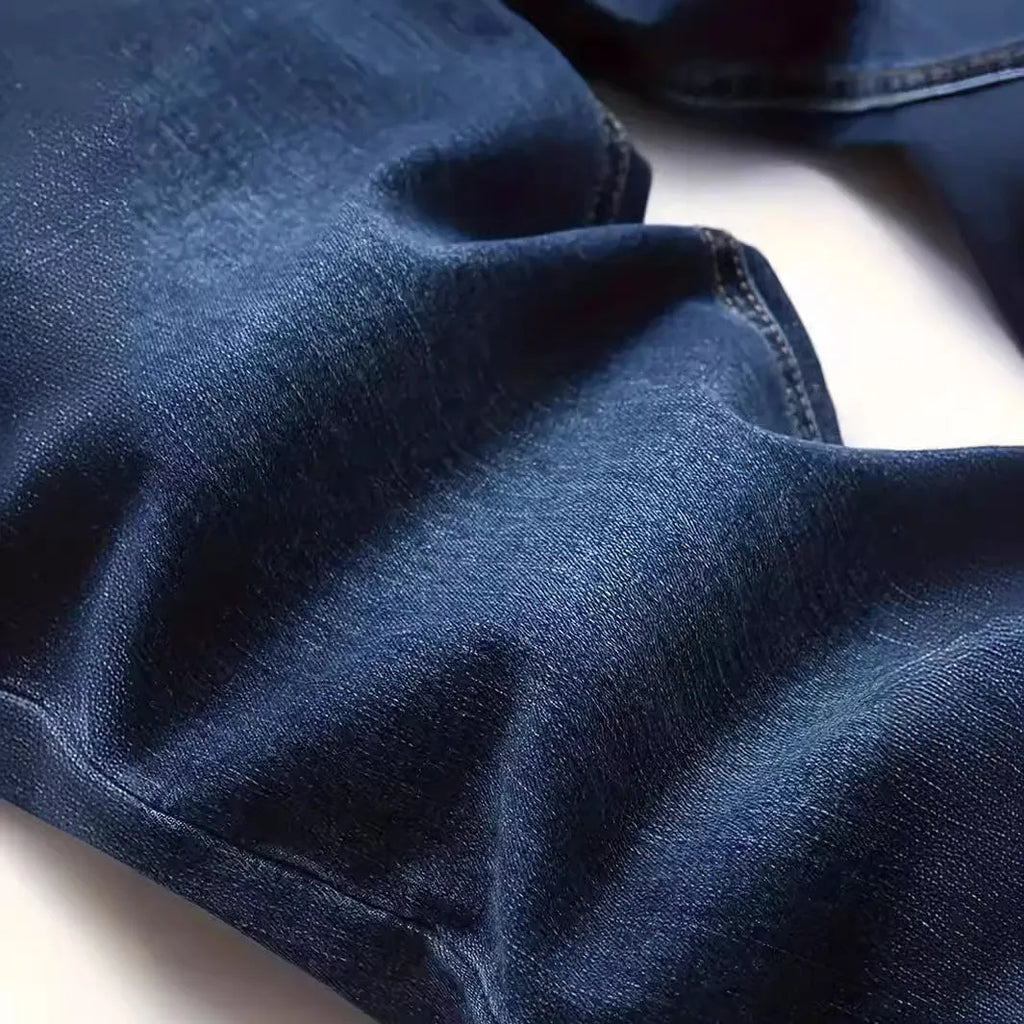 Men's dark blue slim fit jeans with skinny leg design and mid waist cut