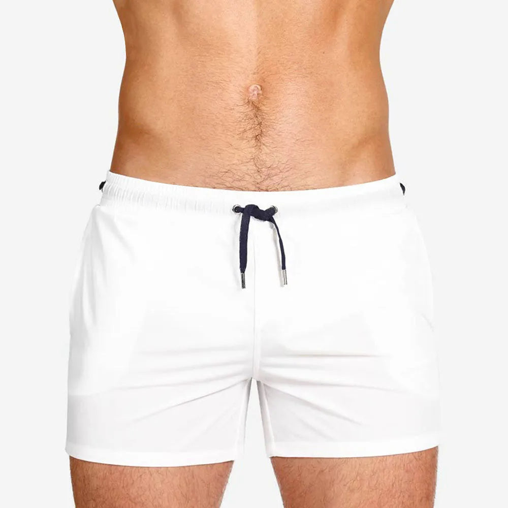 Men's solid colour mesh lining sports shorts for swimming and fitness in polyester fabric