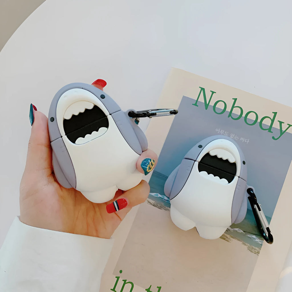 Silicone protective cover for Apple AirPods 1 and 2 charging case with clip-on shark fin decoration.