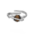 Adjustable opening Saturn ring in electroplated white gold colour with silver construction