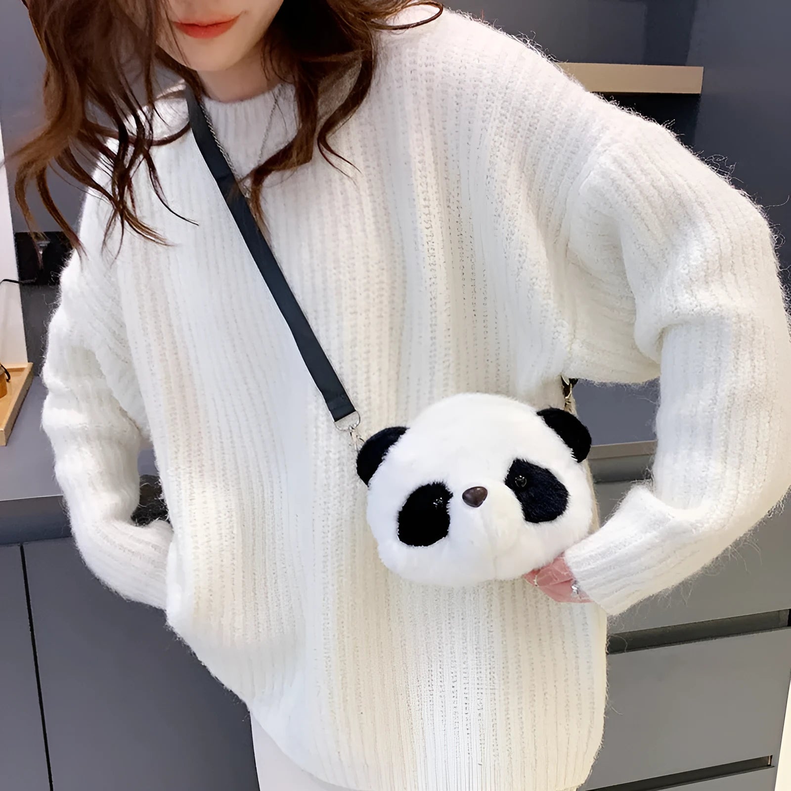 Plush cylindrical crossbody bag with panda design, showing sandwich pocket and shoulder strap