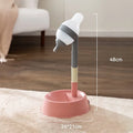 Green adjustable height pet water dispenser with detachable pole and bowl on a floor.